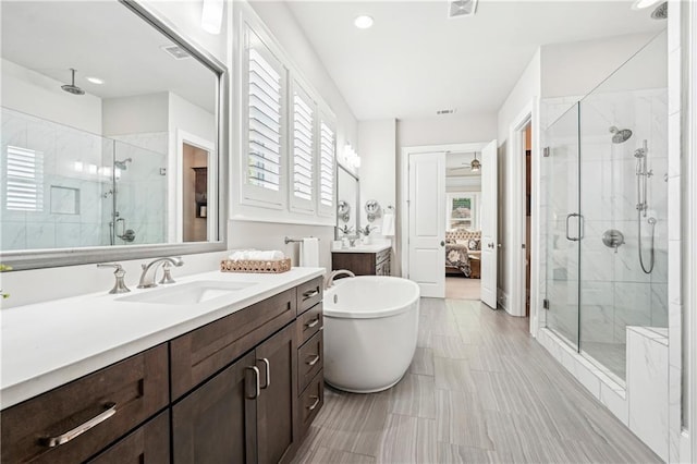 4025 Connolly Ct, Roswell, GA 30075 - bathroom with a stall shower, ensuite bathroom, vanity, and a freestanding tub