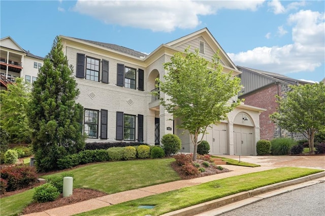 4025 Connolly Ct, Roswell, GA 30075 - colonial home with brick siding, driveway, a front lawn, and a garage