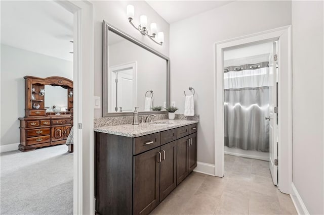 4025 Connolly Ct, Roswell, GA 30075 - bathroom featuring vanity, baseboards, and a shower with shower curtain