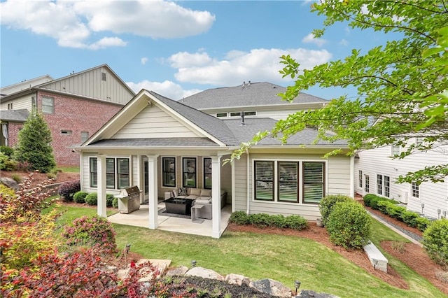 4025 Connolly Ct, Roswell, GA 30075 - rear view of property with a patio, a lawn, an outdoor hangout area, and a shingled roof