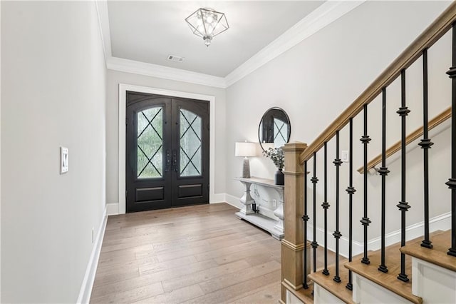 4025 Connolly Ct, Roswell, GA 30075 - entrance foyer featuring wood-type flooring, stairs, ornamental molding, baseboards, and french doors