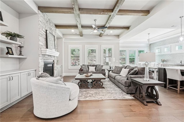 4025 Connolly Ct, Roswell, GA 30075 - living area with a fireplace, a ceiling fan, coffered ceiling, wood finished floors, and beam ceiling