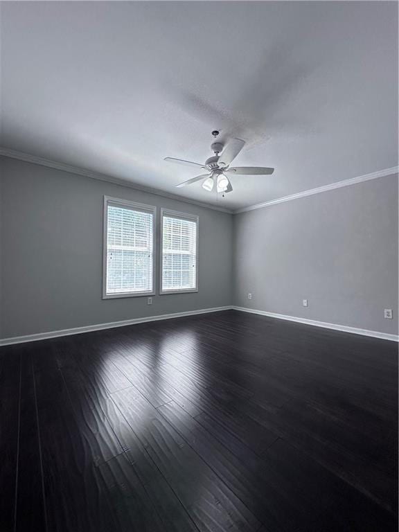 spare room featuring crown molding, ceiling fan, and dark hardwood / wood-style flooring