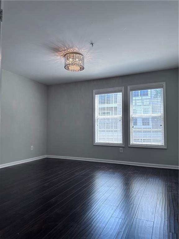 spare room featuring dark hardwood / wood-style floors