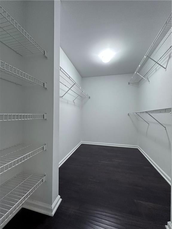 4244 River Green Dr NW Unit 111, Atlanta, GA 30327 - spacious closet featuring wood finished floors