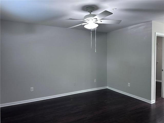 unfurnished room with dark wood-type flooring and ceiling fan