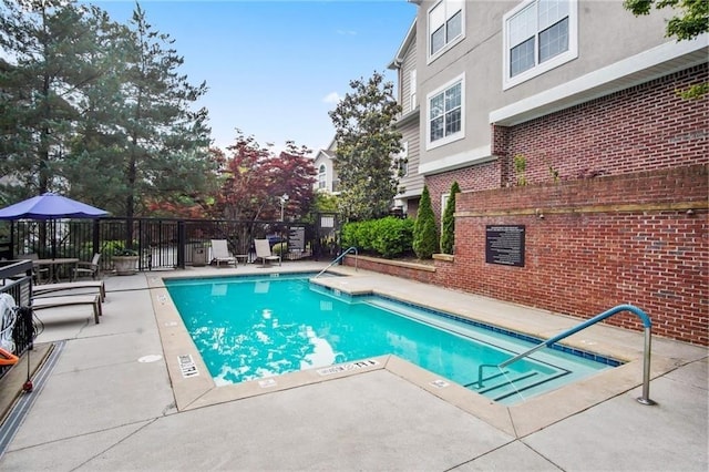 4244 River Green Dr NW Unit 111, Atlanta, GA 30327 - pool with fence and a patio area