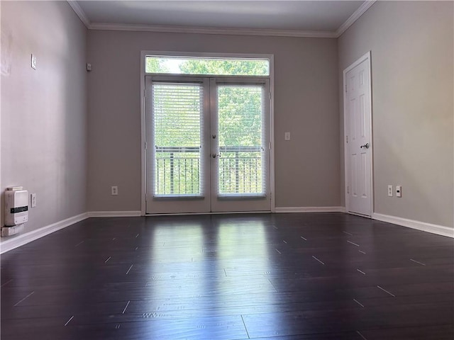 unfurnished room with ornamental molding, dark hardwood / wood-style flooring, and french doors