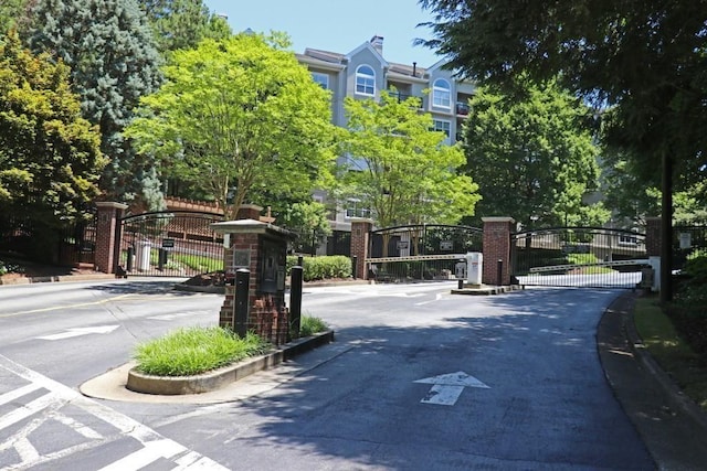 4244 River Green Dr NW Unit 111, Atlanta, GA 30327 - view of road with a gate, a gated entry, and curbs