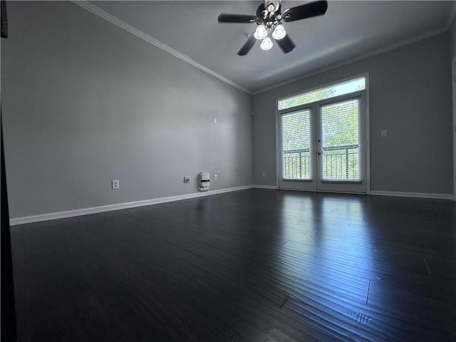 spare room with lofted ceiling, ceiling fan, crown molding, dark wood-type flooring, and french doors