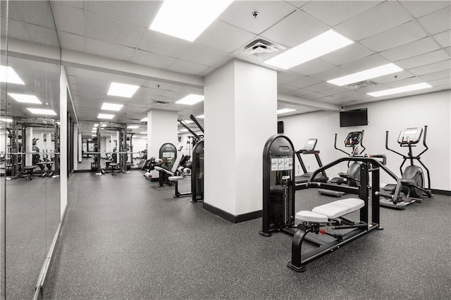 workout area featuring a drop ceiling