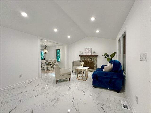 living room featuring lofted ceiling