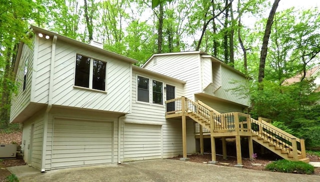 back of house featuring a garage