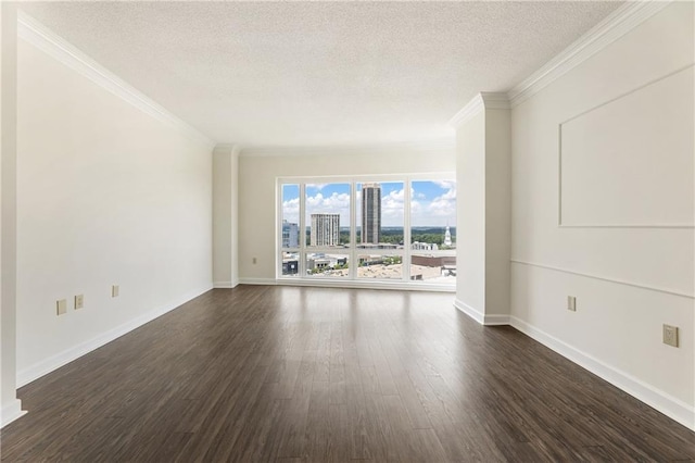 3475 Oak Valley Rd Unit 1850, Atlanta, GA 30326 - empty room featuring a textured ceiling, dark wood-style flooring, ornamental molding, baseboards, and a view of city