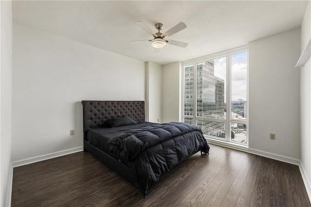 3475 Oak Valley Rd Unit 1850, Atlanta, GA 30326 - bedroom featuring floor to ceiling windows, multiple windows, wood finished floors, baseboards, and a ceiling fan