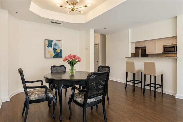 3475 Oak Valley Rd Unit 1850, Atlanta, GA 30326 - dining room with a chandelier, dark wood finished floors, baseboards, and a raised ceiling