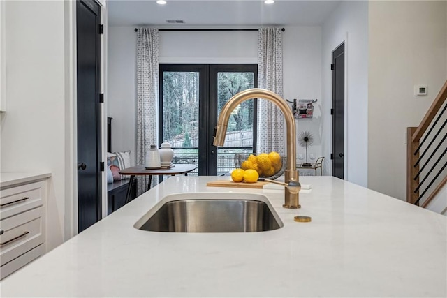 kitchen with sink and white cabinets