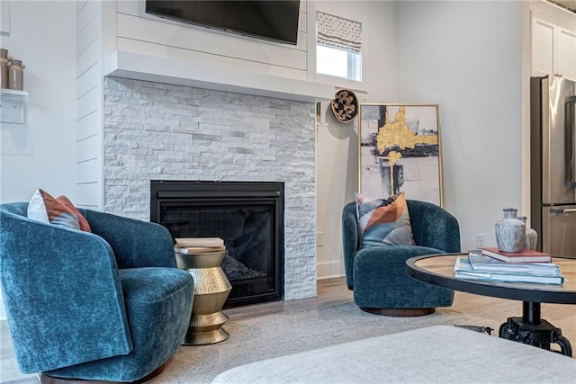 interior space featuring a stone fireplace