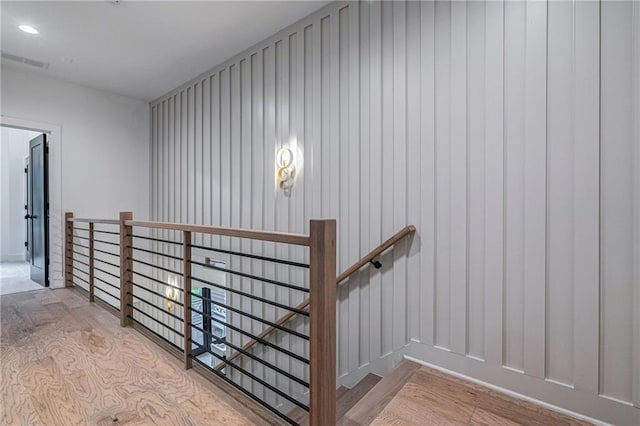 stairs featuring wood-type flooring