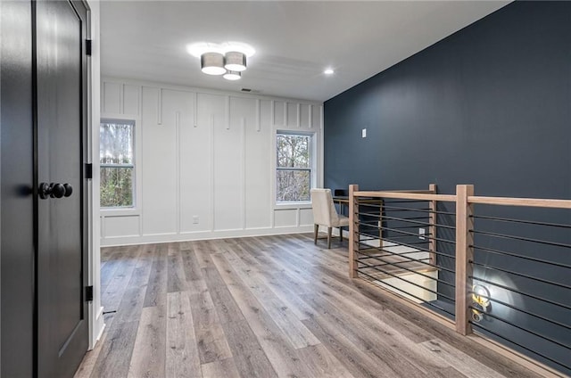 spare room featuring wood-type flooring