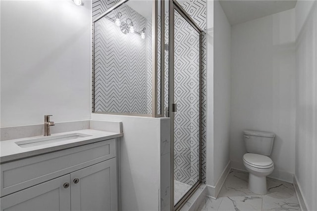 bathroom with vanity, walk in shower, and toilet