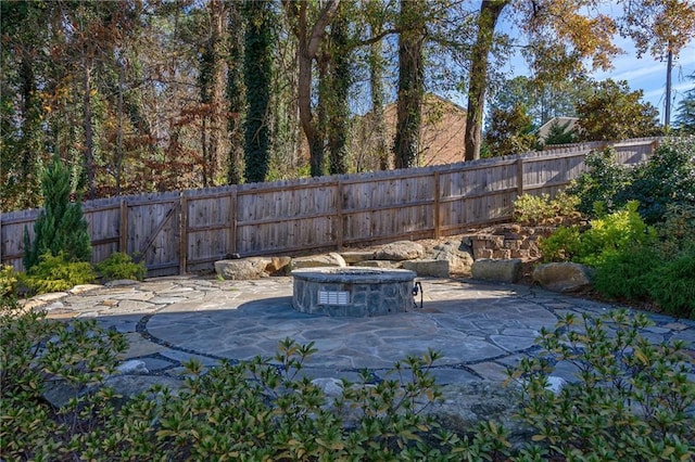 view of patio featuring an outdoor fire pit