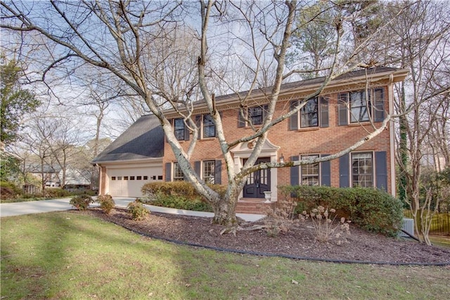 view of front facade featuring a garage and a front lawn