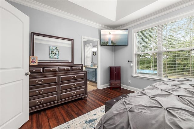 bedroom with ornamental molding, dark hardwood / wood-style floors, and ensuite bath