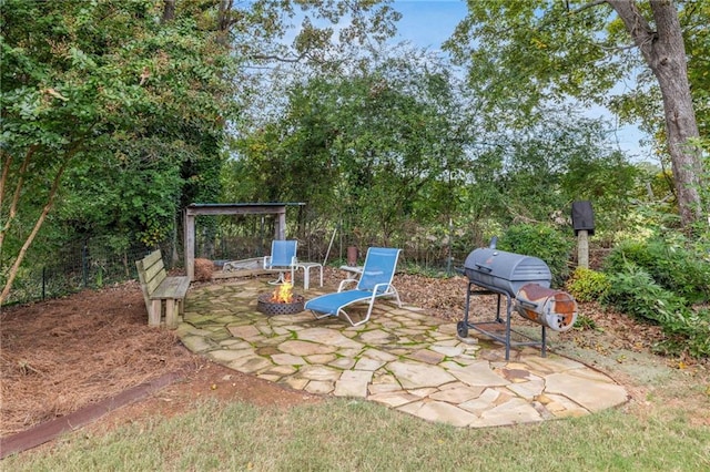 view of patio featuring grilling area and an outdoor fire pit