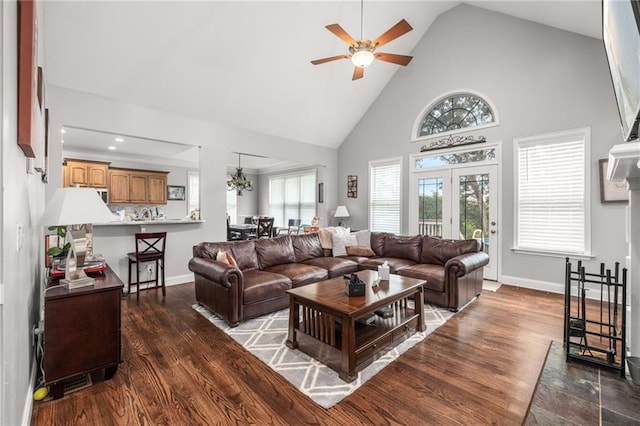 living room with high vaulted ceiling, dark hardwood / wood-style floors, and ceiling fan