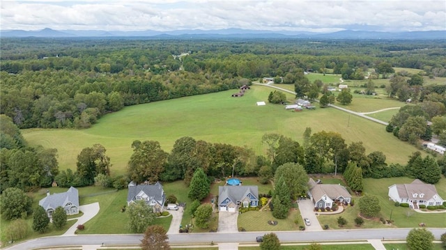 birds eye view of property featuring a mountain view