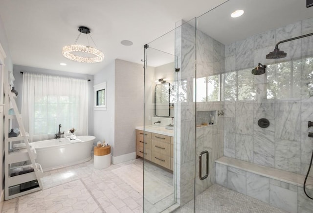 bathroom with vanity and separate shower and tub