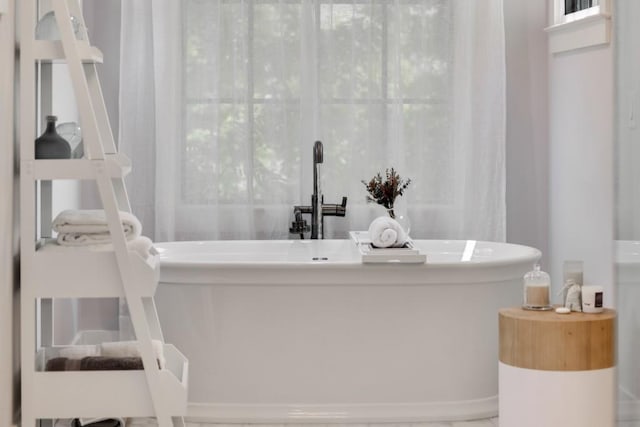 bathroom with a washtub