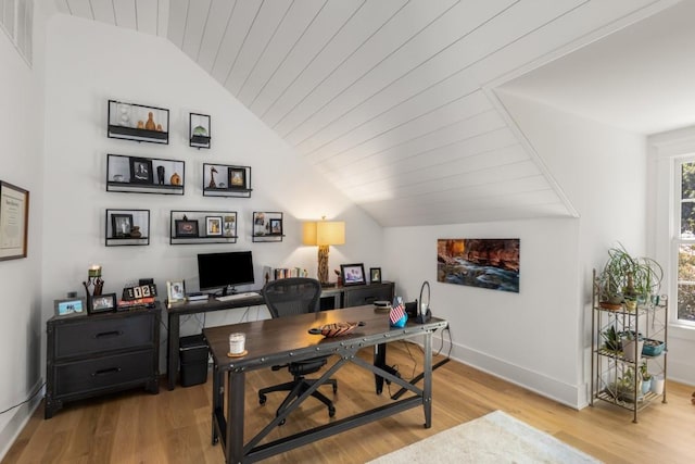 office area with light hardwood / wood-style flooring, wood ceiling, and vaulted ceiling