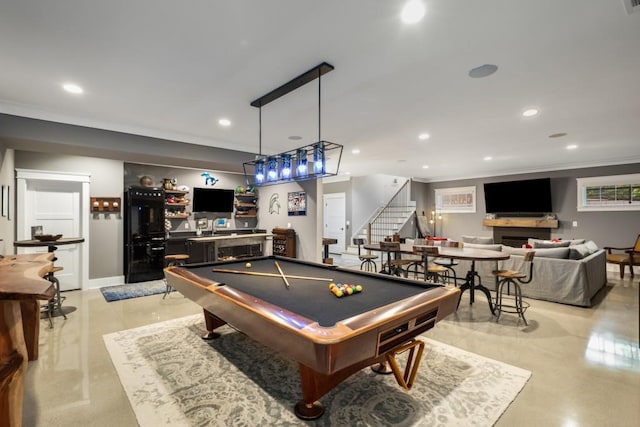 playroom featuring bar, ornamental molding, and billiards