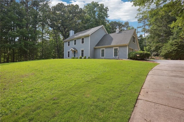 285 Aspen Way, Fayetteville, GA 30214 - colonial inspired home featuring a chimney, a front yard, and driveway