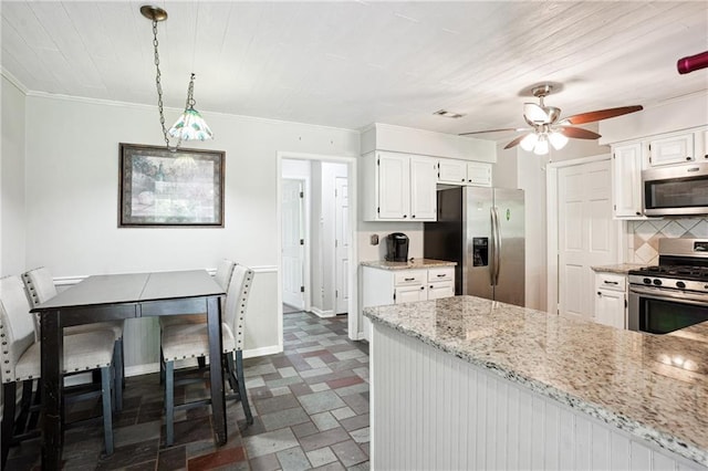 285 Aspen Way, Fayetteville, GA 30214 - kitchen with stainless steel appliances, ceiling fan, crown molding, dark flooring, and white cabinets