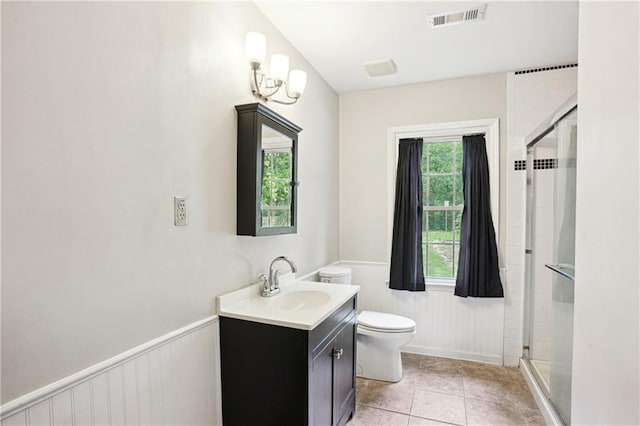 285 Aspen Way, Fayetteville, GA 30214 - bathroom featuring vanity, toilet, a wainscoted wall, a stall shower, and tile patterned floors