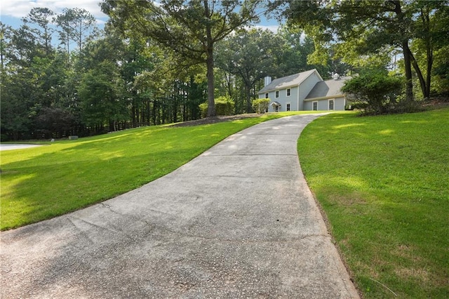 285 Aspen Way, Fayetteville, GA 30214 - colonial inspired home featuring a front yard, driveway, and a garage