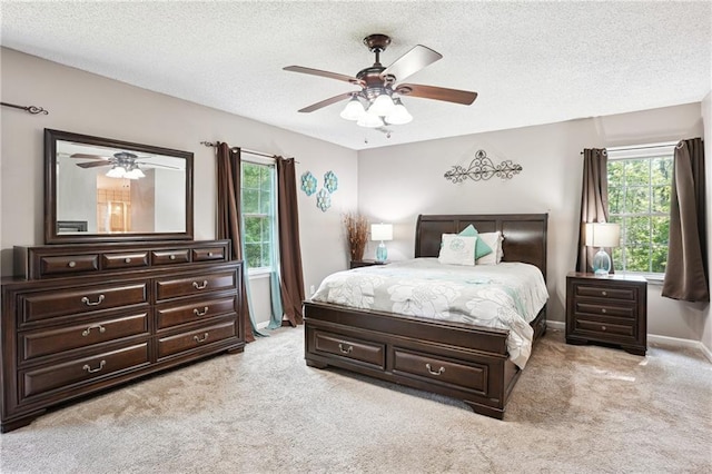 285 Aspen Way, Fayetteville, GA 30214 - bedroom with light colored carpet, a textured ceiling, baseboards, and a ceiling fan
