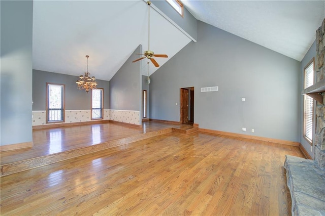 unfurnished living room featuring visible vents, light wood-style flooring, and plenty of natural light