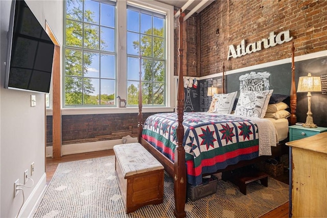 978 N Ave NE Unit 207, Atlanta, GA 30306 - bedroom with baseboards and wood finished floors