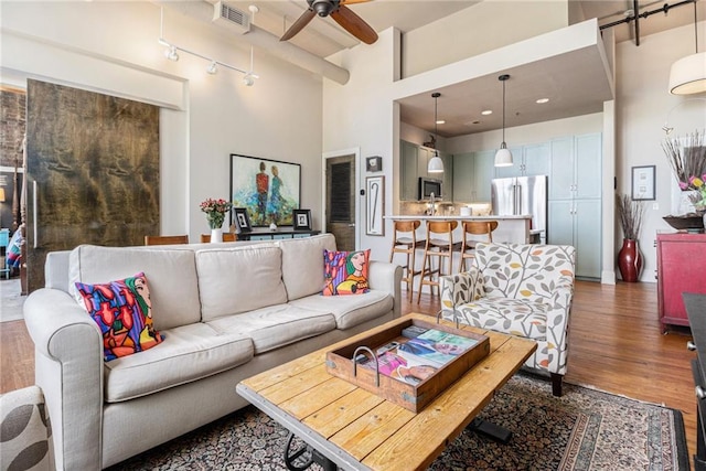 978 N Ave NE Unit 207, Atlanta, GA 30306 - living room with a towering ceiling, a ceiling fan, visible vents, and wood finished floors
