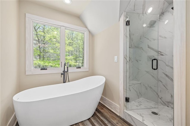 275 River Cliff Dr, Cornelia, GA 30531 - full bath with wood finished floors, a marble finish shower, a freestanding tub, baseboards, and lofted ceiling