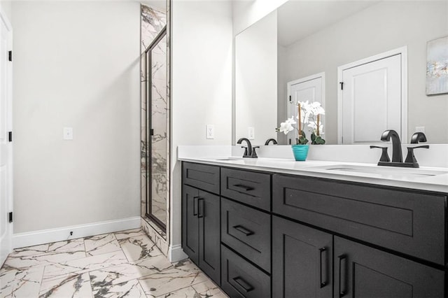 bathroom featuring a shower with door and vanity