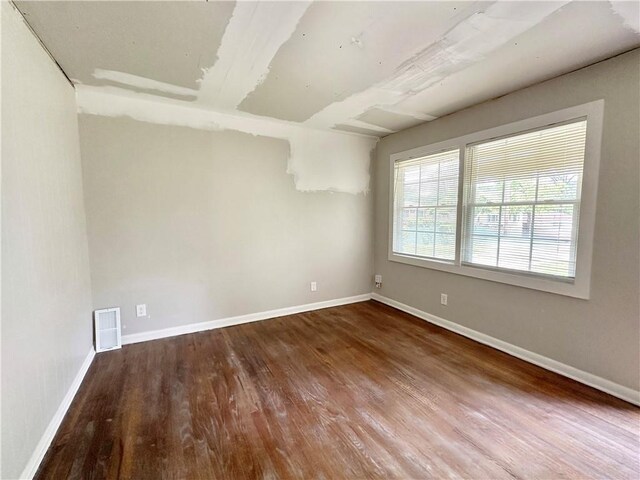 empty room featuring hardwood / wood-style flooring