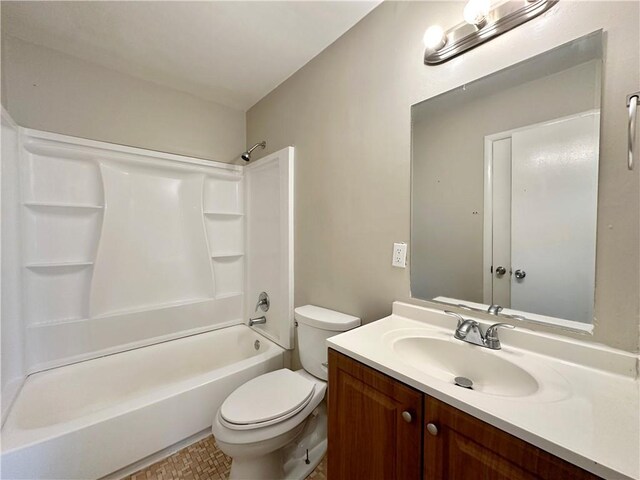 full bathroom with shower / bathtub combination, vanity, and toilet