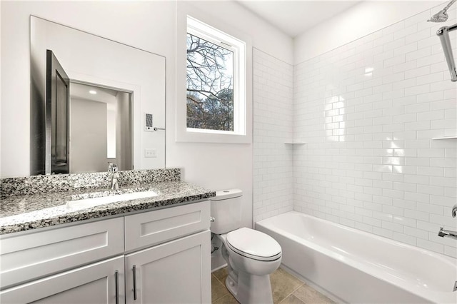 full bathroom with toilet, tile patterned floors, vanity, and tiled shower / bath combo