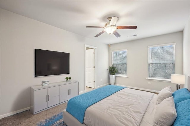 bedroom featuring ceiling fan and light colored carpet