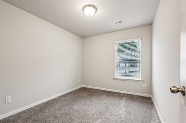 unfurnished room featuring carpet